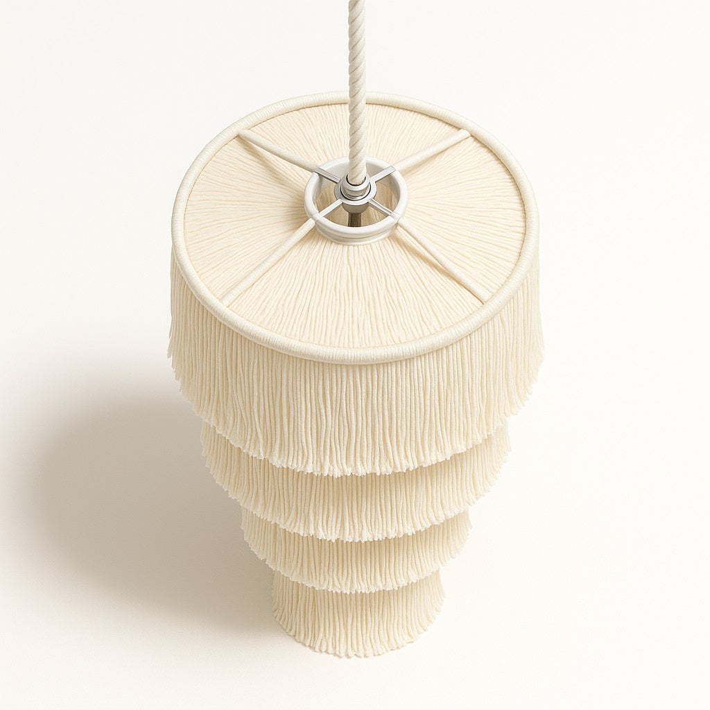 Abat-jour blanc Lumae en coton naturel vu du dessus, structure cylindrique à franges en cascade raffinée.