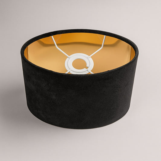 Vue de dessus de l’abat-jour ovale en velours noir Noctaria, intérieur doré et structure métallique blanche E27.