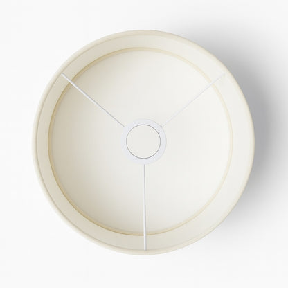 Vue du dessus d’un abat-jour tambour blanc en tissu pour lampadaire, finition sobre et soignée.