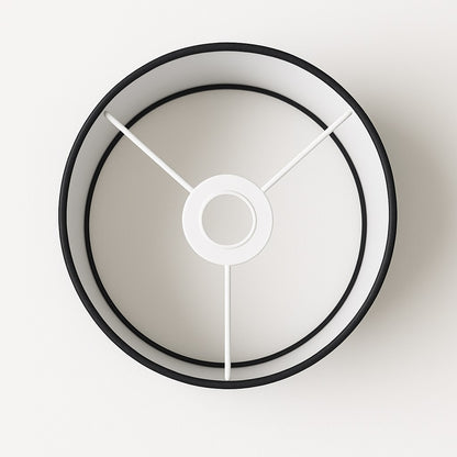 Vue intérieure d’un abat-jour noir tambour pour lampe de chevet ou lampadaire, structure E27 visible.