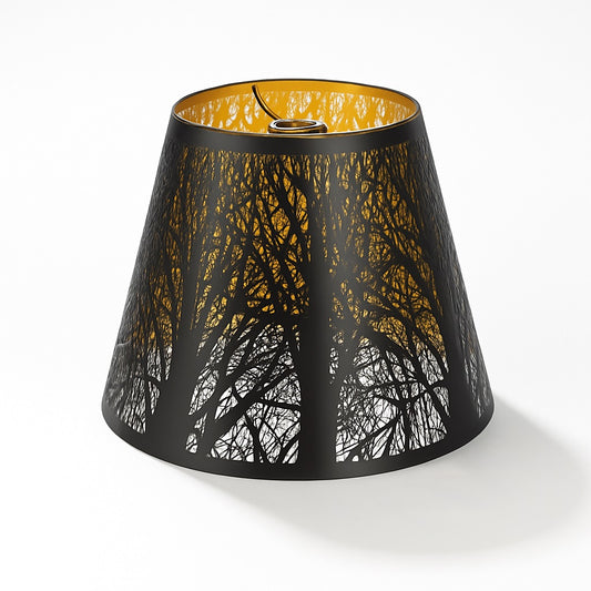 Abat-jour conique ajouré noir avec intérieur doré, motif forêt, idéal pour lampe ou suspension au style moderne et poétique.
