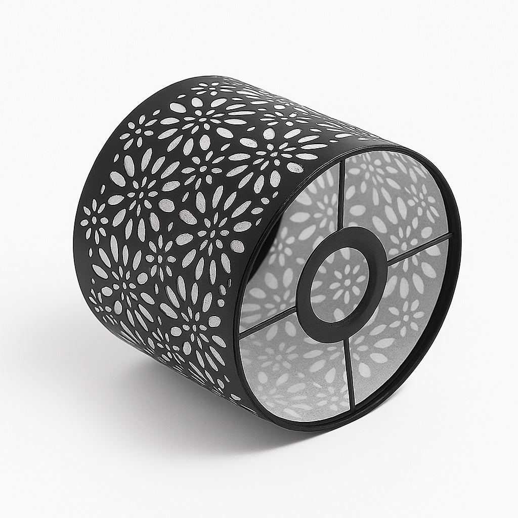 Abat-jour cylindrique noir à motif floral ajouré, couché au sol – design élégant et lumineux pour intérieur moderne