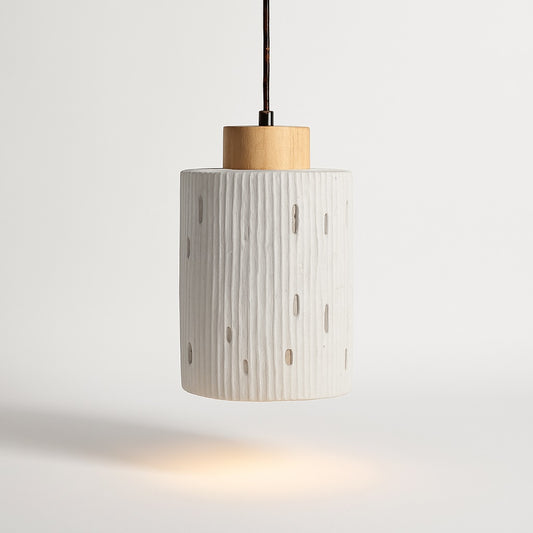 Abat-jour suspension cylindrique en ciment strié et bois clair, design sculptural et lumière douce pour déco contemporaine.